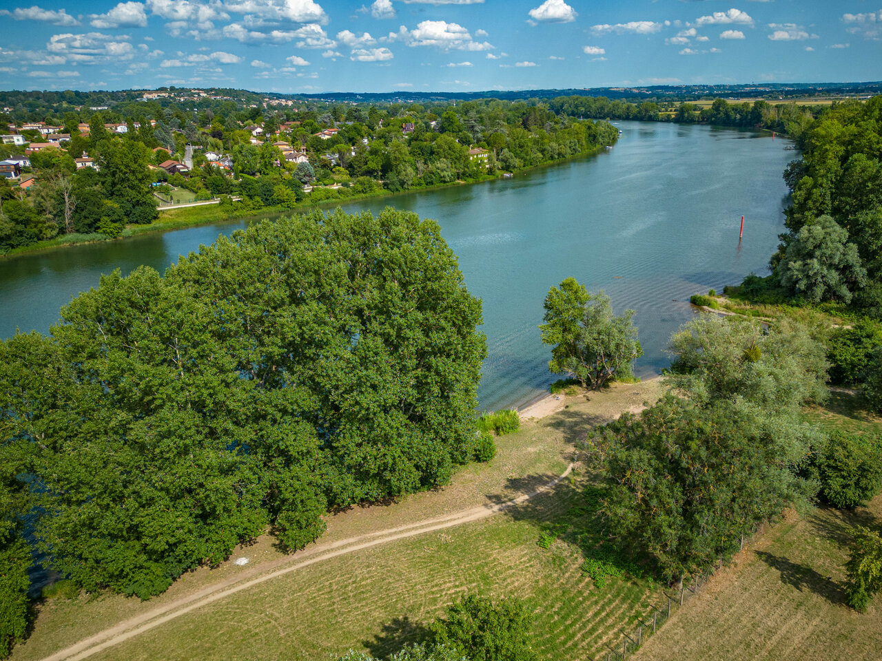 Aerial view river, green nature, blue sky at CAPFUN Les Portes du Beaujolais.