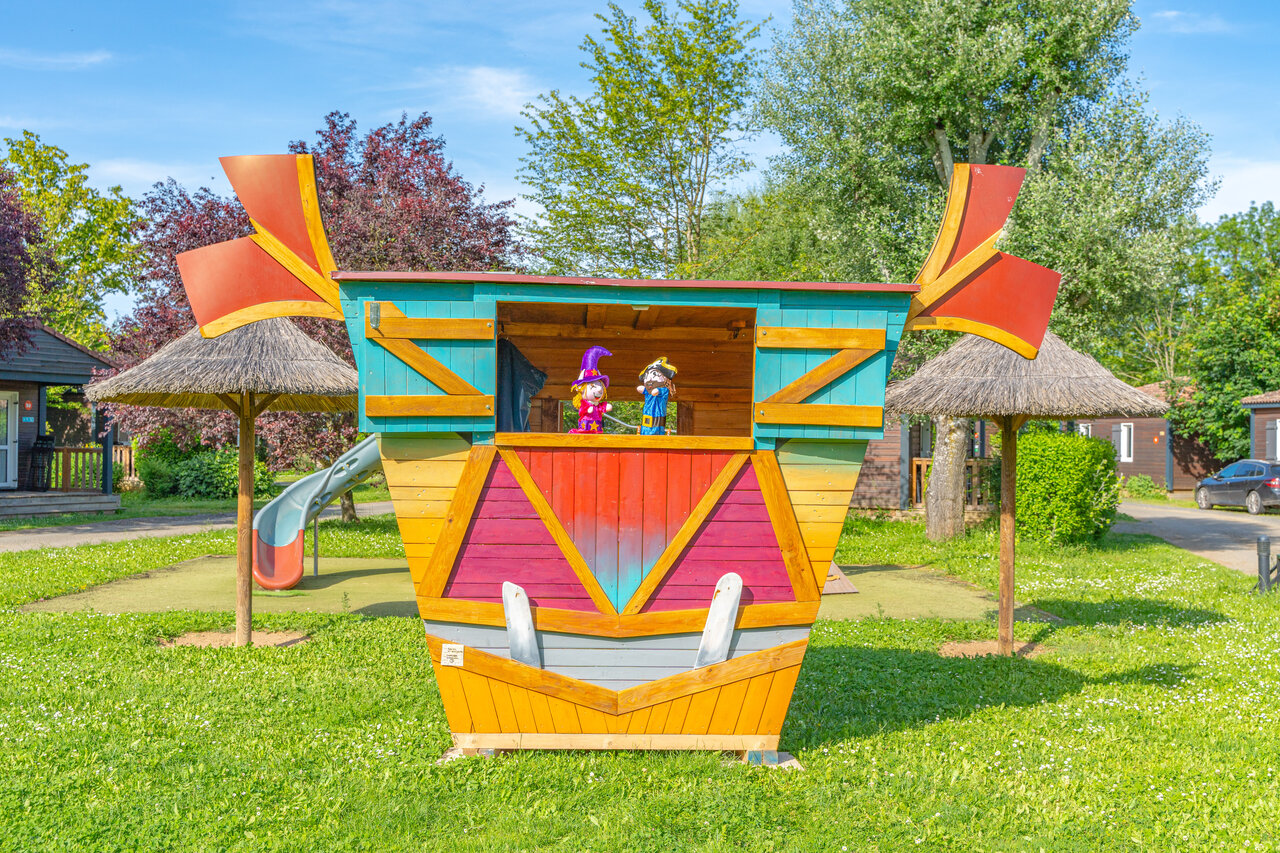 Puppet theater, slide at CAPFUN Les Portes du Beaujolais campsite in Anse.