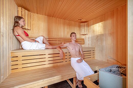 Wooden sauna with couple at CAPFUN Les Portes du Beaujolais in Anse (69).