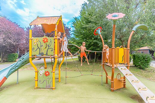 Playground with slides at CAPFUN Les Portes du Beaujolais campsite in Anse (69).