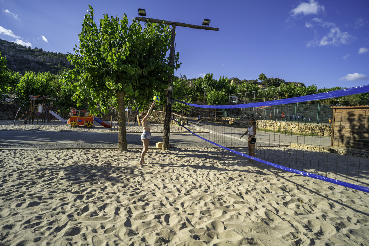 Beach volleyball on sand and playground at CAPFUN Serra de Prades campsite in Vilanova de Prades (43).