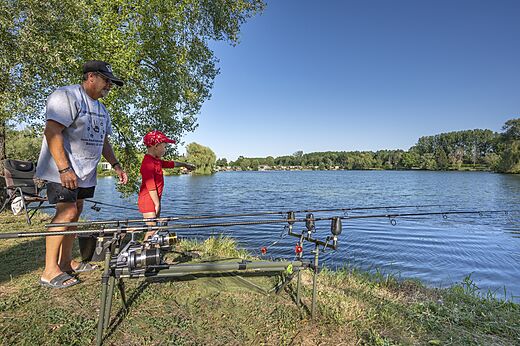 Fishing at lake at camping VAGUES OCEANES Pr�s de la Fontaine � Gouaix (77).
