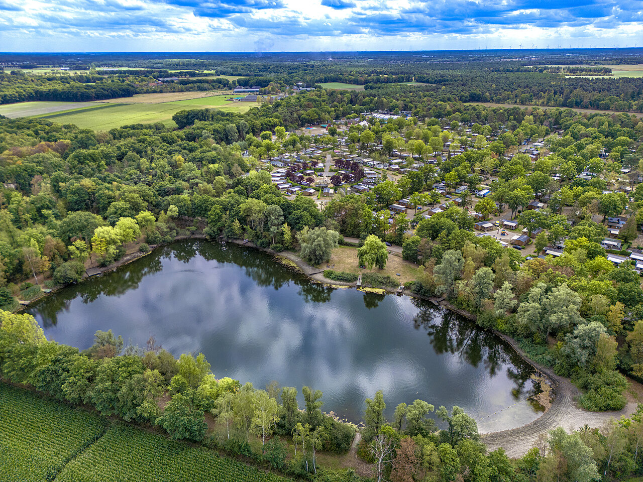 Aerial view of the lake and Mobile homes at CAPFUN Rakelbos campsite in Westelbeers.
