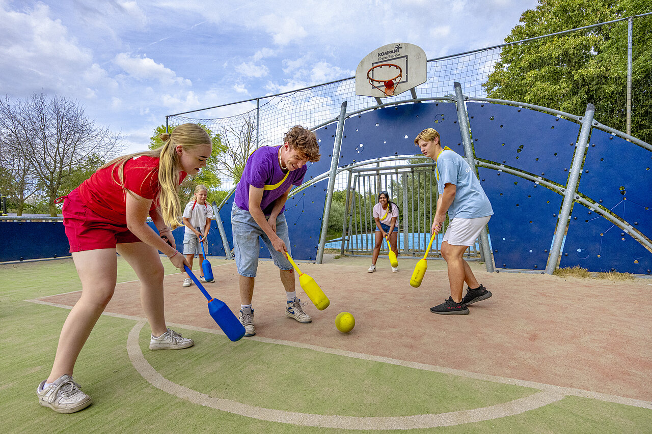 Bat and ball game on multisport court at CAPFUN Rakelbos in Westelbeers.