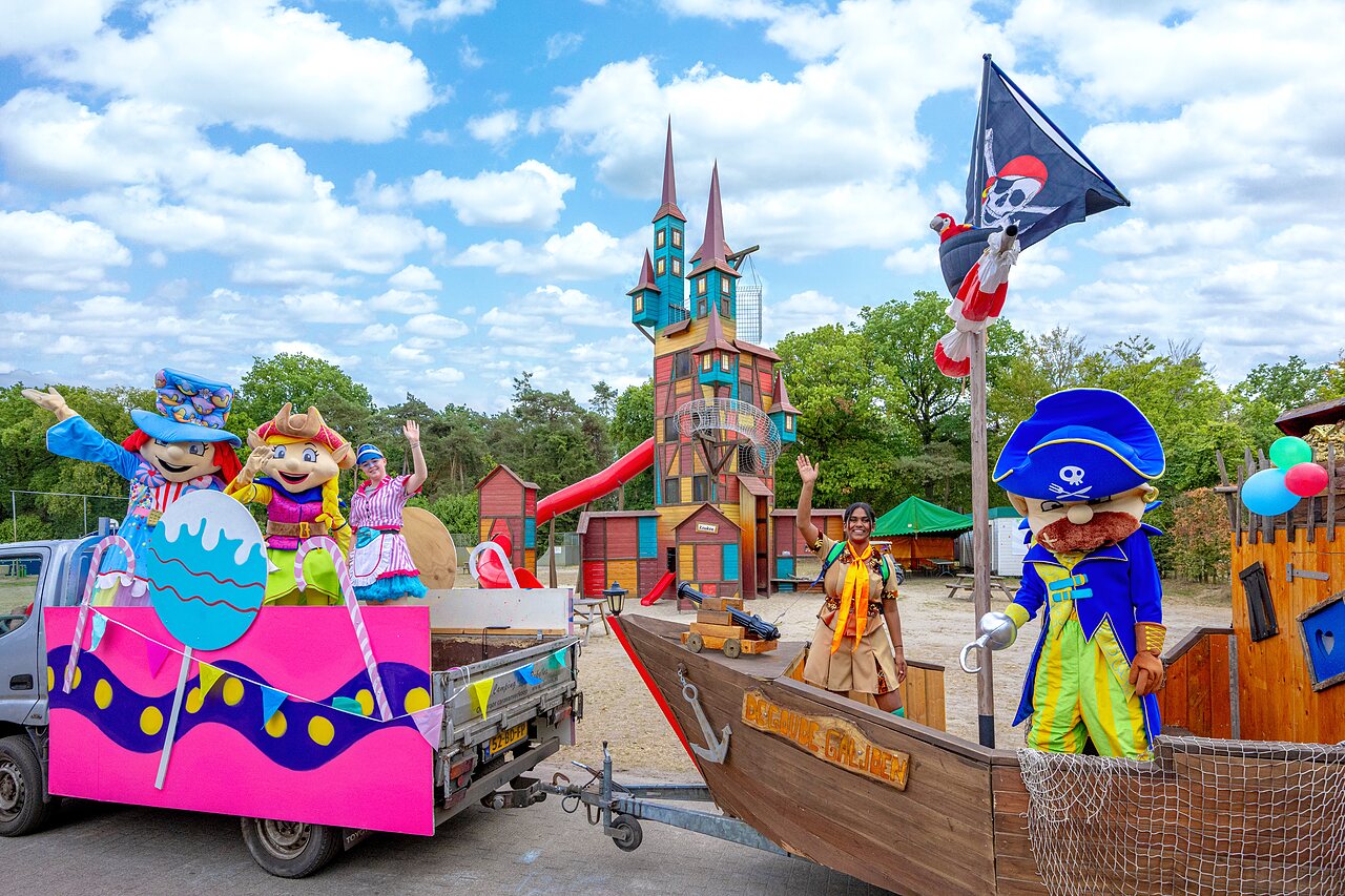 Mascots and large play structure with slide at CAPFUN Rakelbos campsite in Westelbeers.