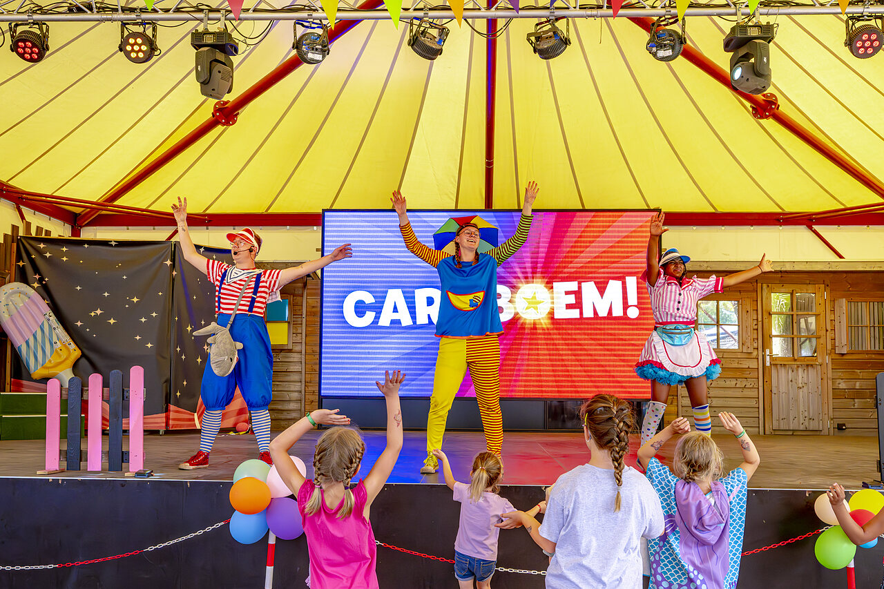 Animators on stage with children, fun show at CAPFUN Rakelbos campsite in Westelbeers.
