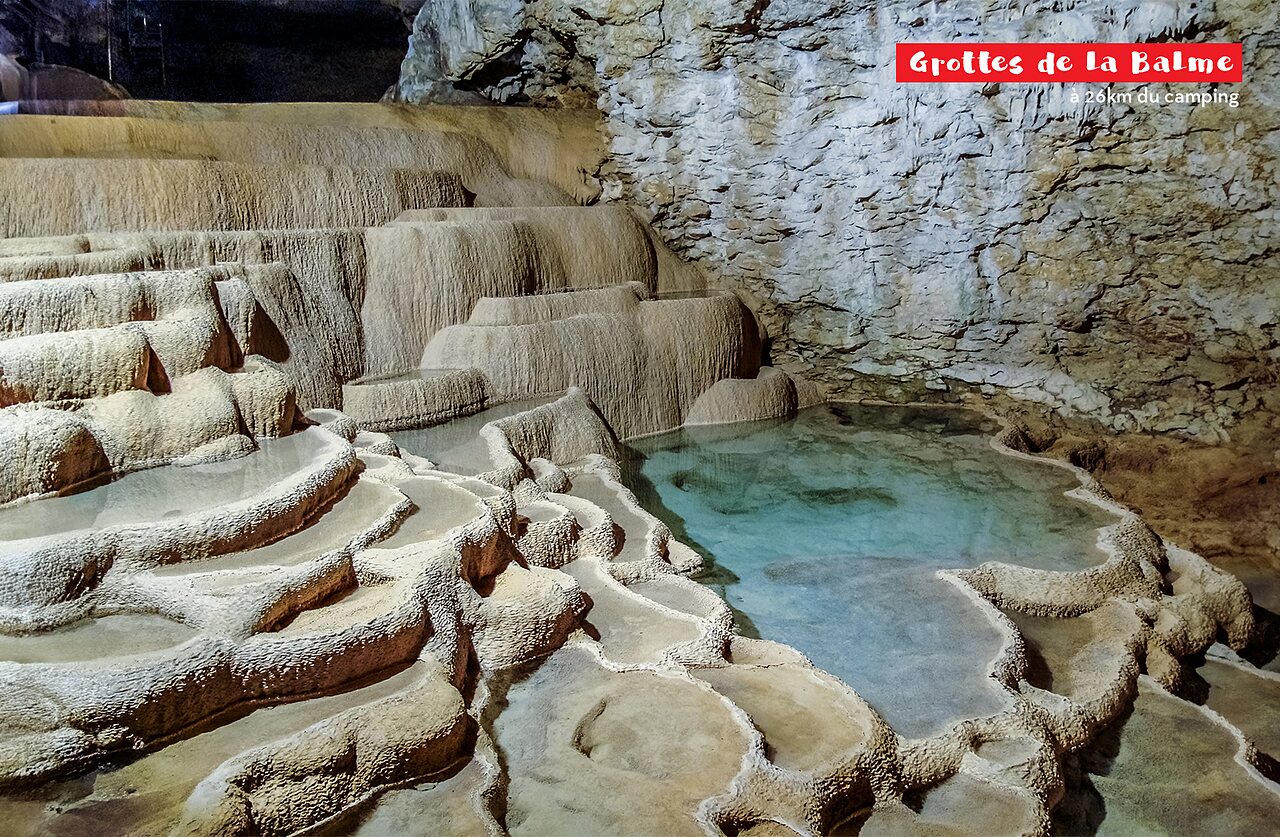 La Balme Caves, rock formations and turquoise water pools to visit.