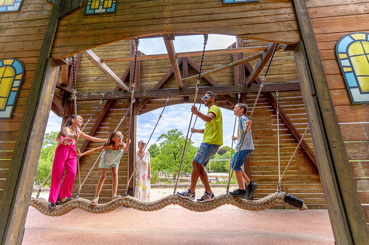 Rope bridge, playground, family at CAPFUN Roca d'Amour campsite in PADIRAC.