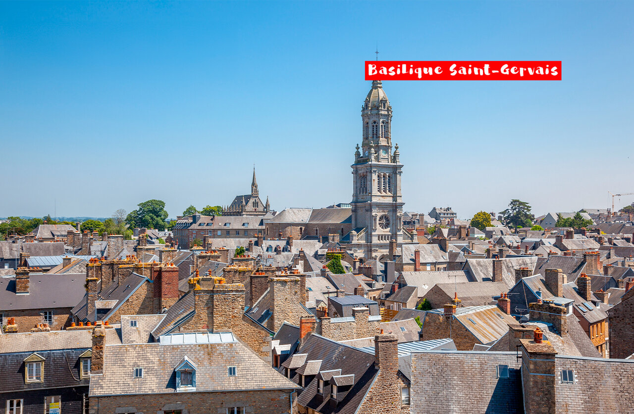 Saint-Gervais Basilica and historic city rooftops in Avranches, Normandy.