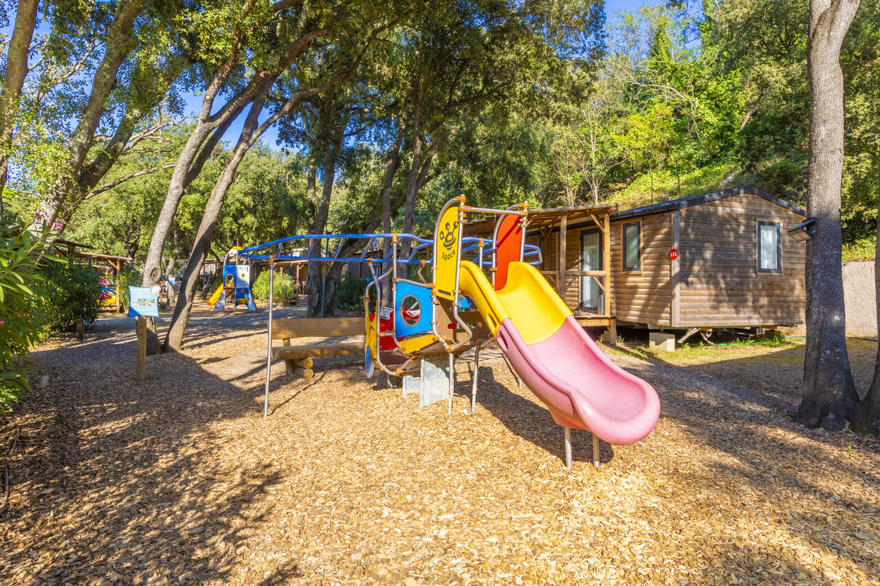 Colorful playground, slide and Mobile homes at CAPFUN La Rumba, Fr�jus (83).