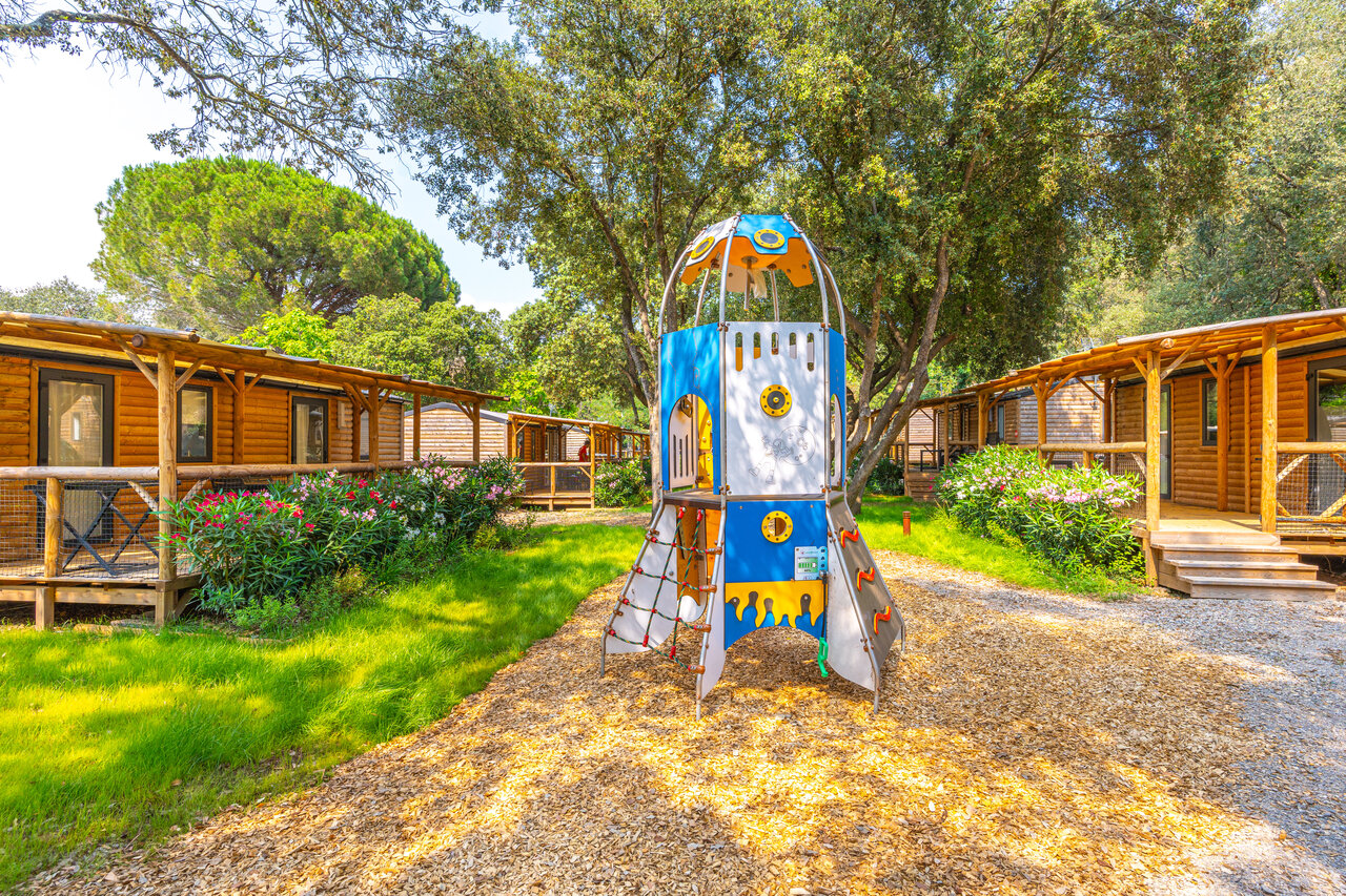 Rocket playground and wooden Mobil-homes at CAPFUN La Rumba campsite in Fr�jus (83).
