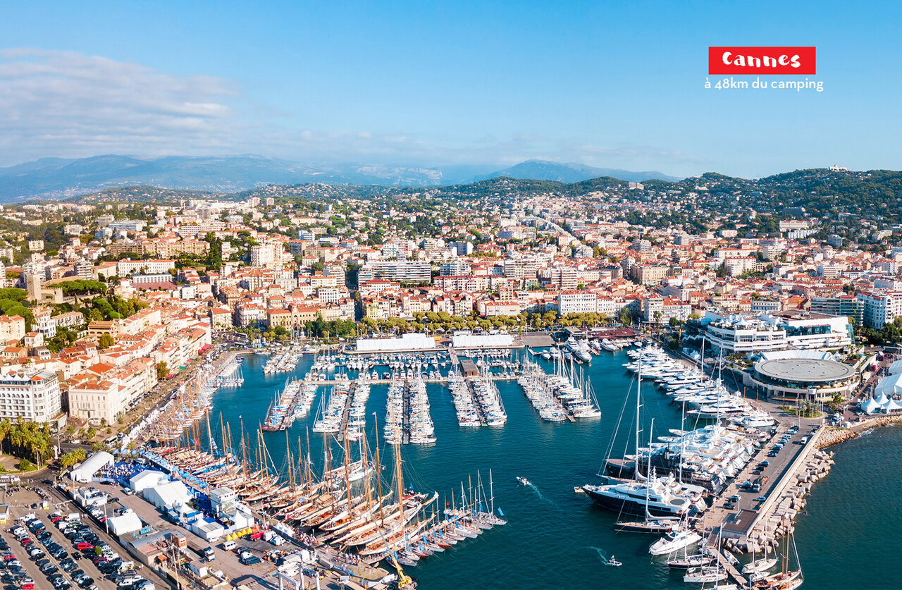 Cannes port, yachts, and city, a must-visit on the French Riviera.