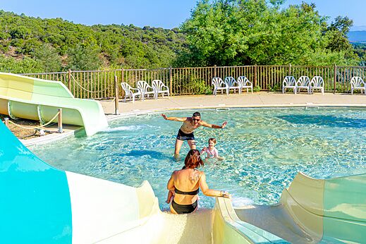 Outdoor pool, water slides, family at CAPFUN La Rumba campsite in Fréjus.