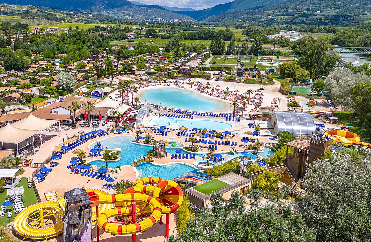 Aerial view water park, pools, slides and Mobile homes at CAPFUN Sagittaire campsite in VINSOBRES (26).