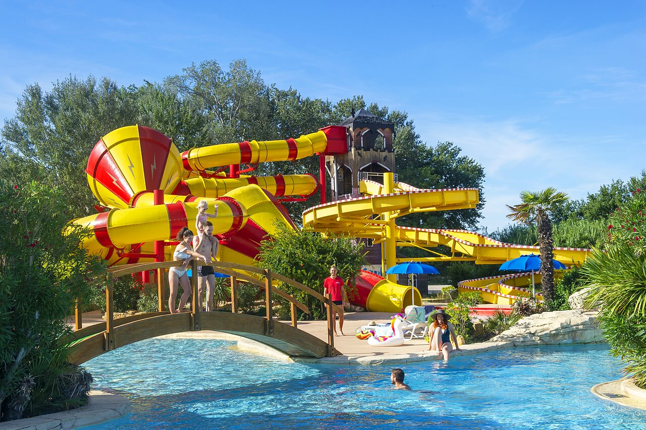 Outdoor swimming pool with giant water slide at CAPFUN Sagittaire campsite in VINSOBRES (26).