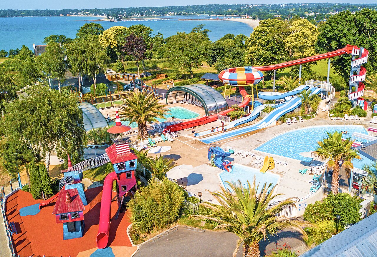 Water park with slides, pools, and play area at CAPFUN Saint Laurent campsite in LA FORET FOUESNANT.