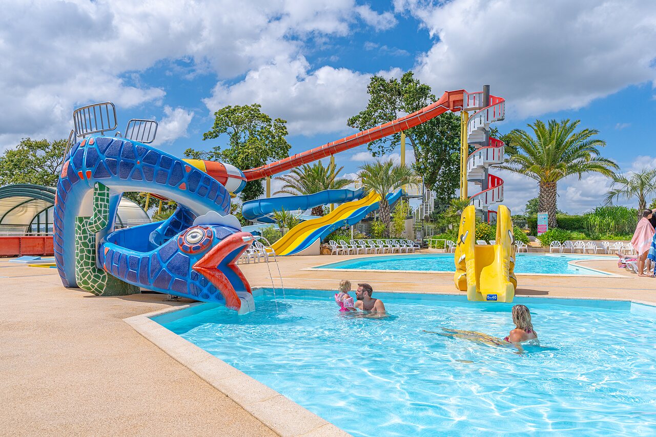 Water slides, family outdoor pool at CAPFUN Saint Laurent campsite in LA FORET FOUESNANT.