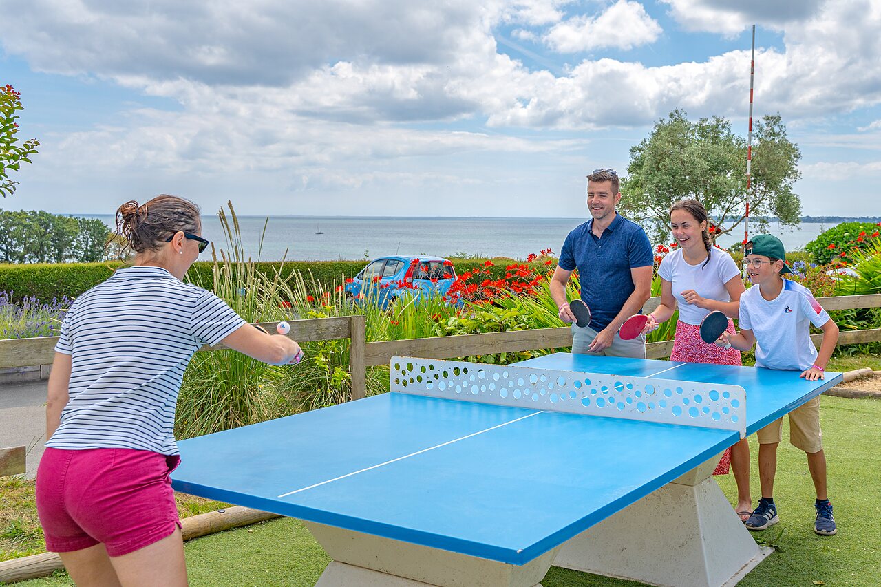 Table tennis with family at CAPFUN Saint Laurent campsite in LA FORET FOUESNANT (29).