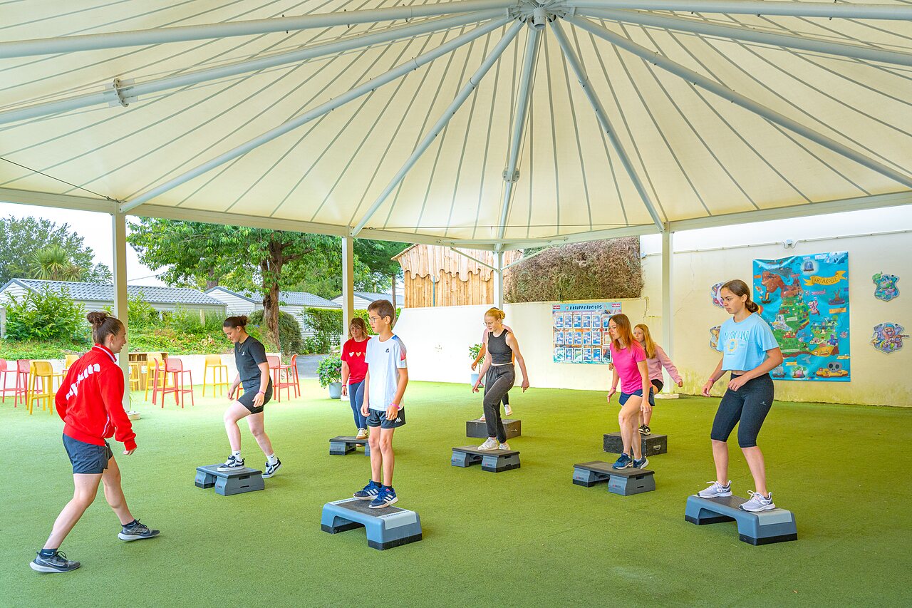 Group step class, entertainment at CAPFUN Saint Laurent campsite in LA FORET FOUESNANT.