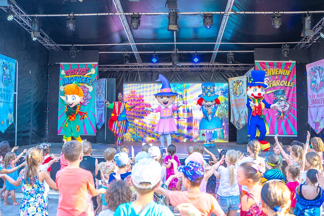 Animation show with mascots and children at CAPFUN Soubeyranne campsite, REMOULINS (30).