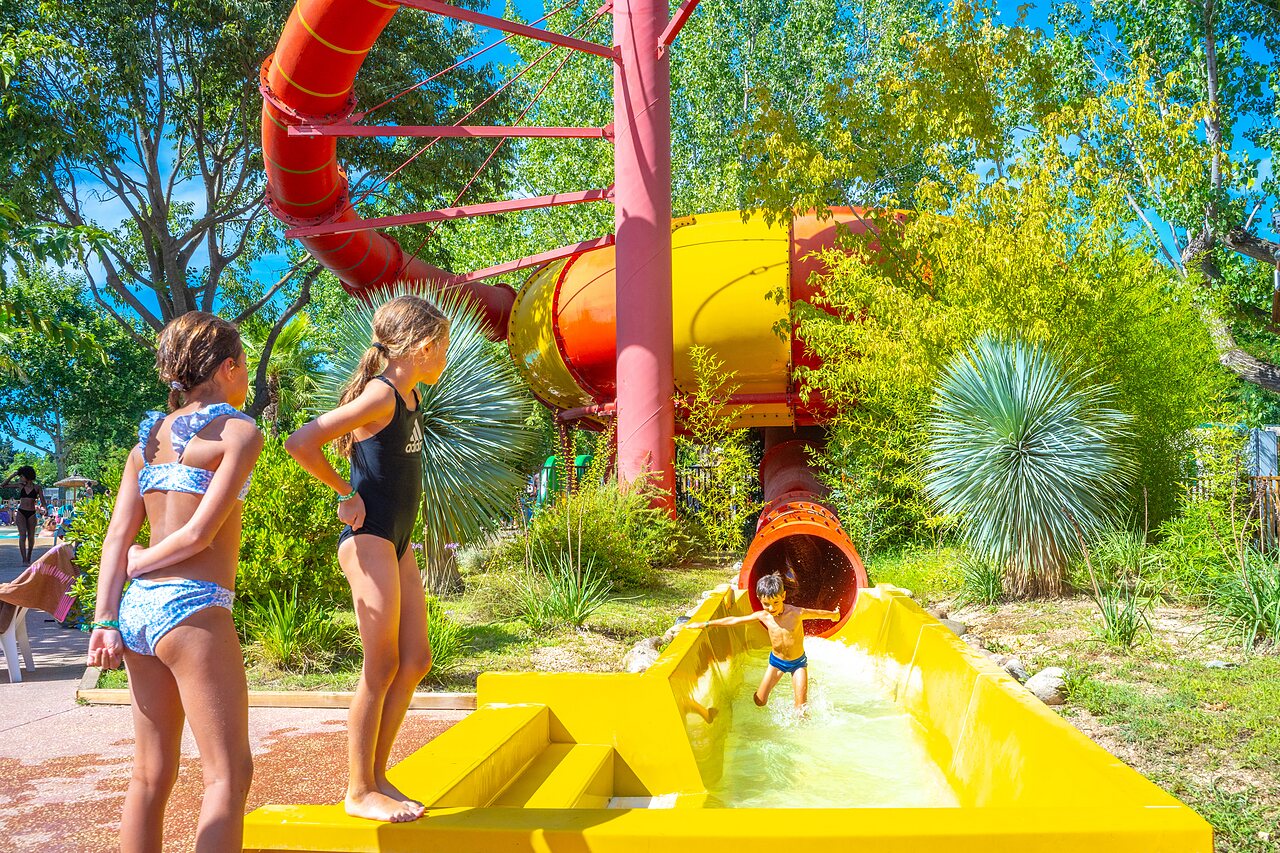 Giant water slide, children at the pool CAPFUN Soubeyranne in REMOULINS (30).