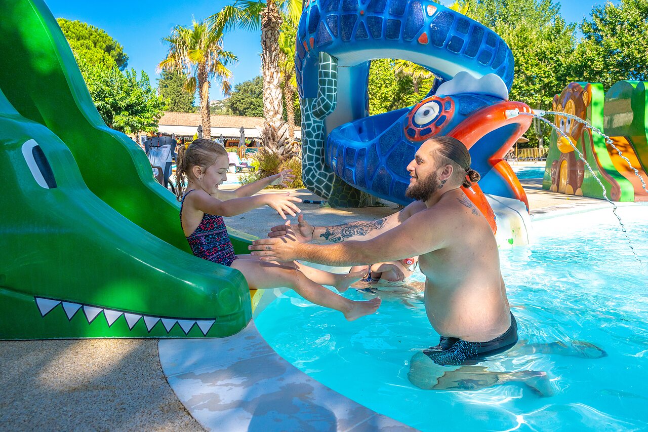 Crocodile slide, child and adult in water park CAPFUN Soubeyranne in REMOULINS.