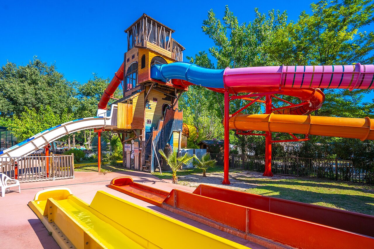 Colorful water slide complex at CAPFUN Soubeyranne campsite in REMOULINS (30).