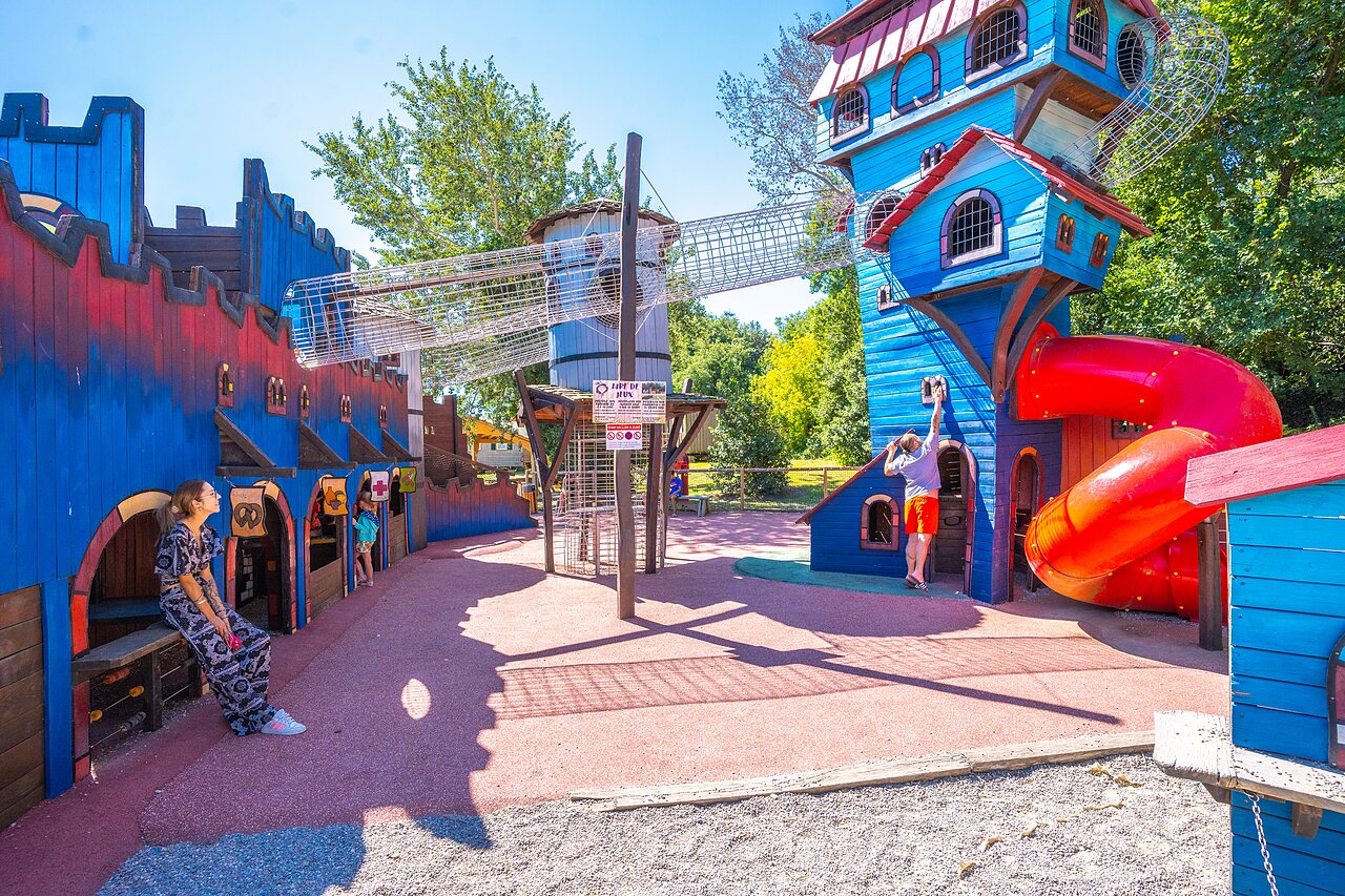 Giant playground with slides and climbing structures at CAPFUN Soubeyranne campsite in REMOULINS (30).