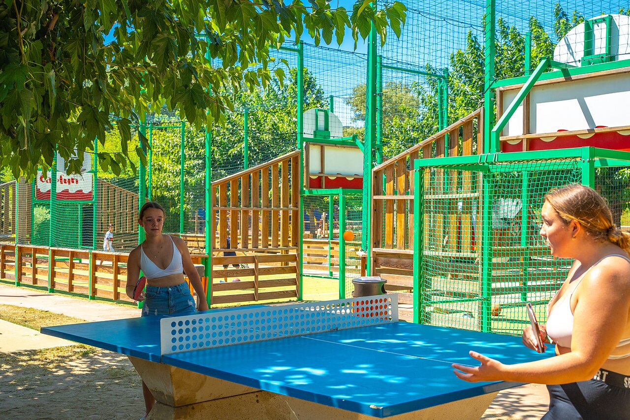 Table tennis game at CAPFUN Soubeyranne campsite in REMOULINS (30).