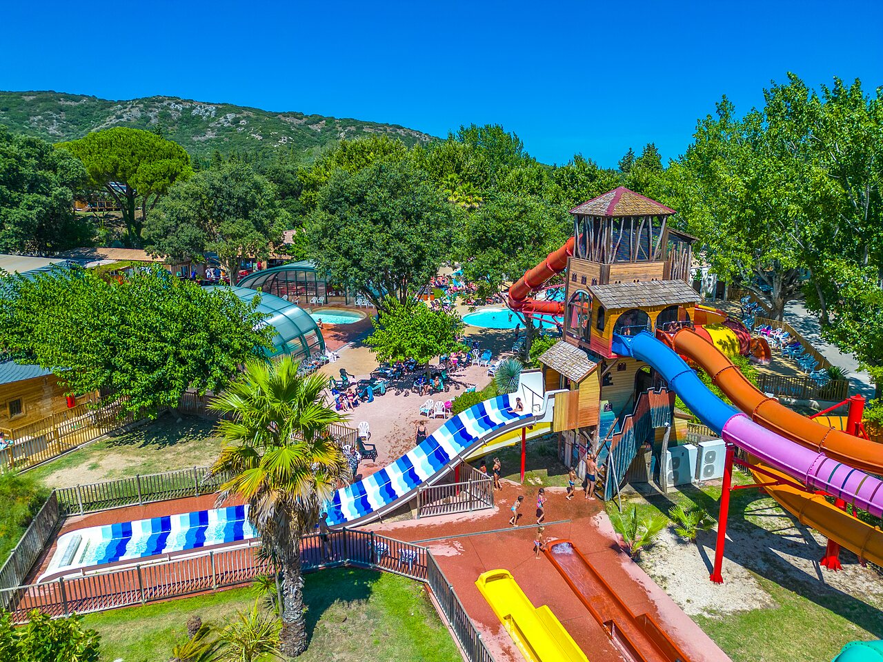 Water slides, outdoor and indoor pool at CAPFUN Soubeyranne campsite in REMOULINS (30).