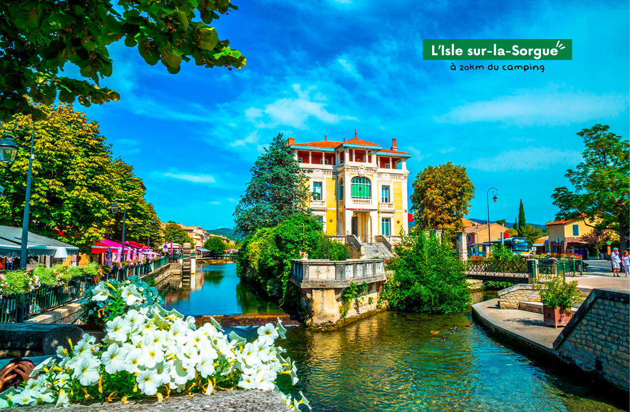 L'Isle sur-la-Sorgue, Proven�al town near campsite, with river and colorful houses.
