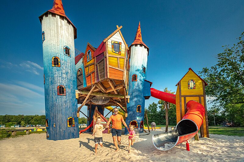 Carabouille playground - Colorful castle playground with slides at CAPFUN het Stoetenslagh campsite Rheezerveen.