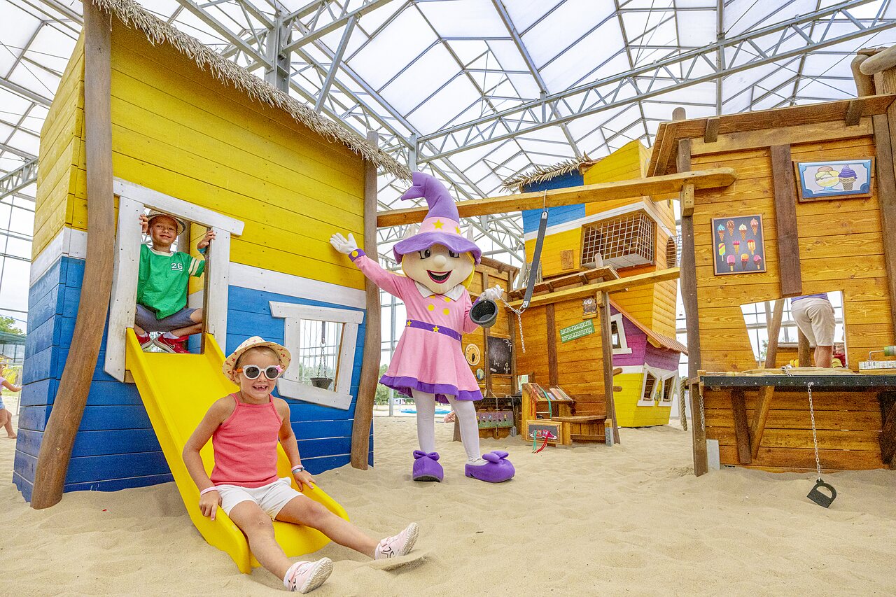 Children on slide in indoor play area at CAPFUN campsite in Rheezerveen.
