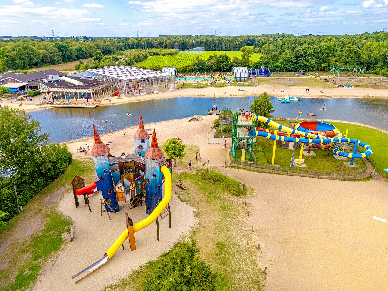 Playground, water slides, lake at CAPFUN Vakantiepark Capfun het Stoetenslagh campsite in Rheezerveen.