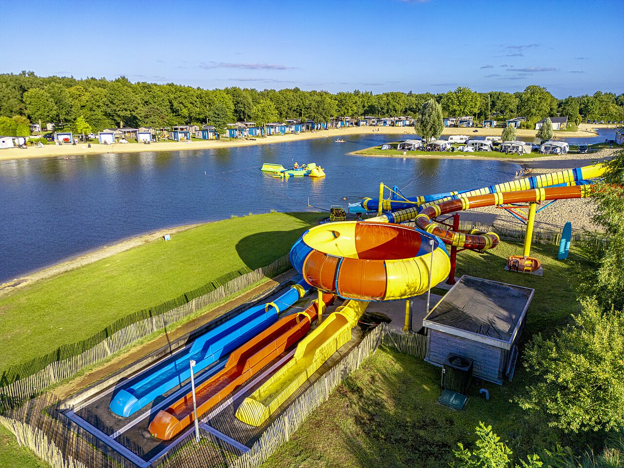 Giant water slides and sandy lake beach at CAPFUN Vakantiepark Capfun het Stoetenslagh.
