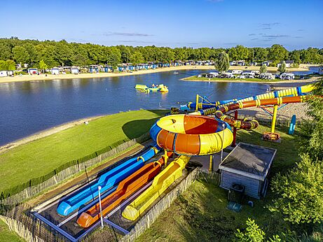 Giant water slides and sandy lake beach at CAPFUN Vakantiepark Capfun het Stoetenslagh.