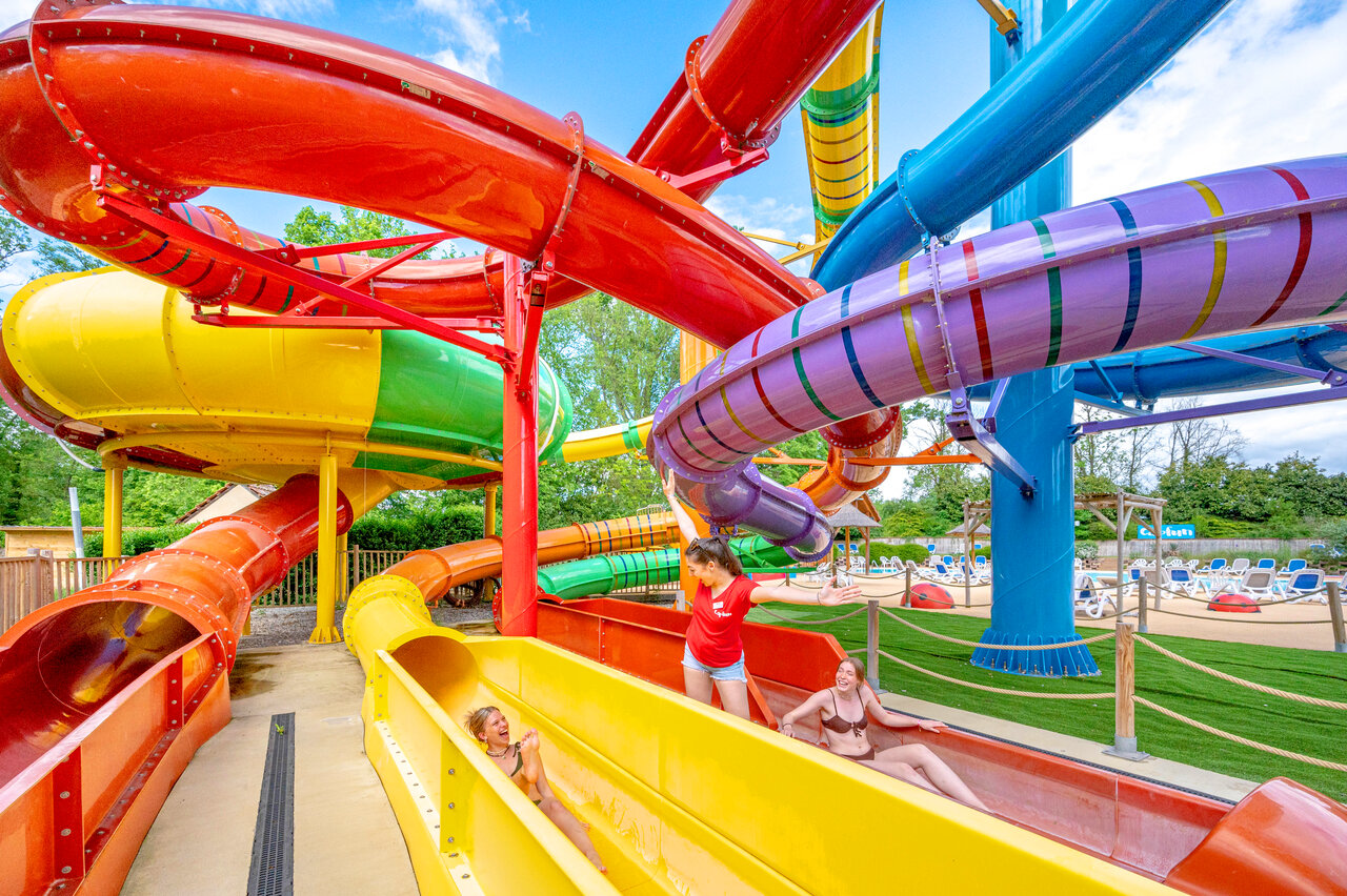 Colorful water slides and swimming pool at CAPFUN Suzel in Sainte-Croix-en-Plaine (68).