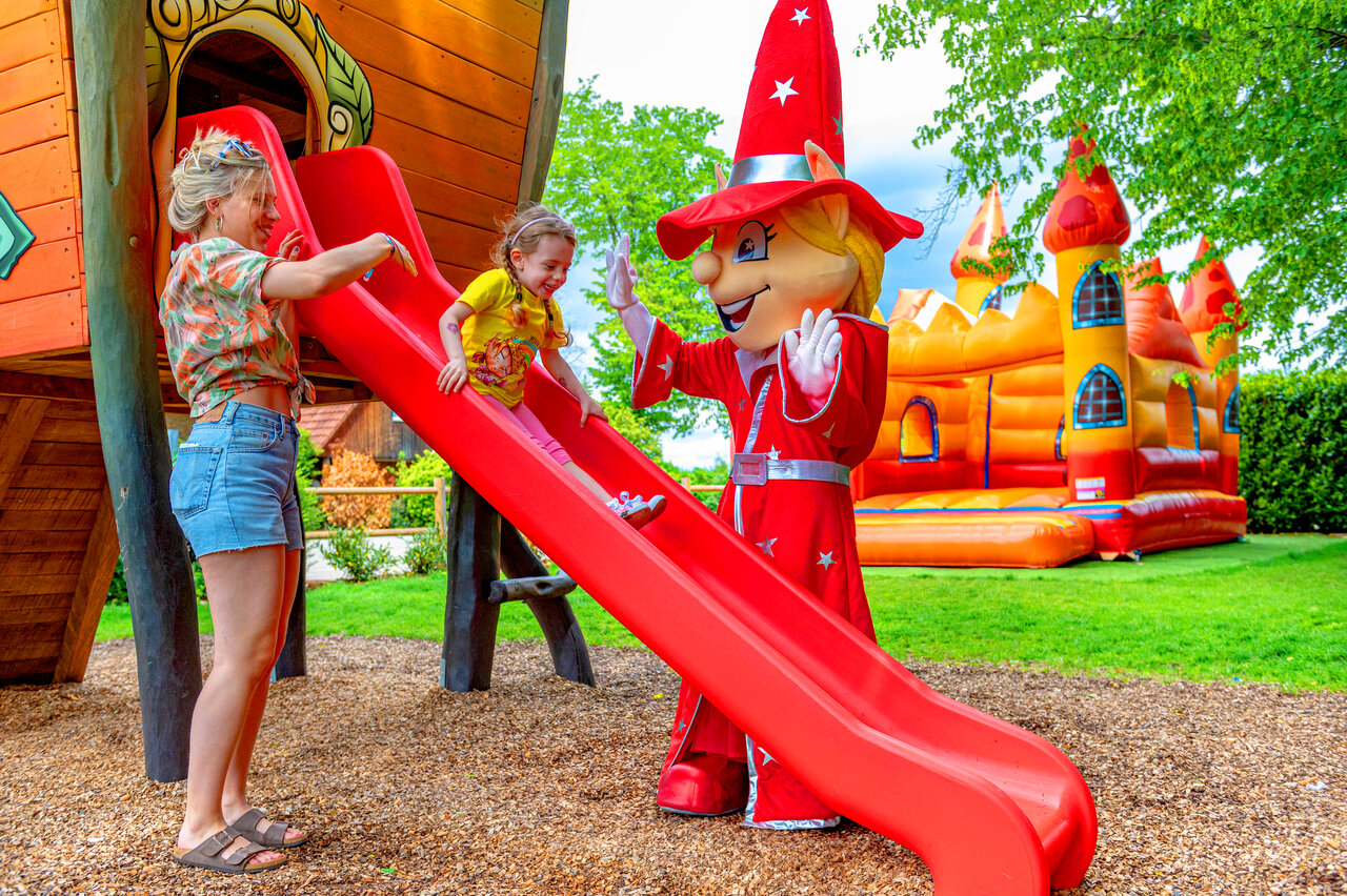 Slide, child, mascot and bouncy castle at CAPFUN Suzel campsite (68).