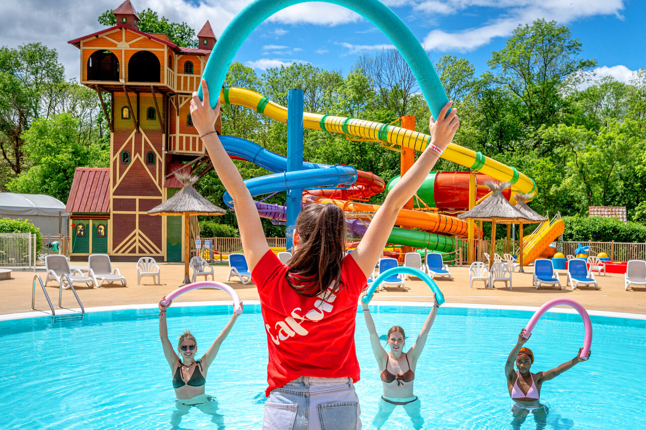 Aquagym in pool with slides at CAPFUN Suzel campsite in Sainte-Croix-en-Plaine (68).