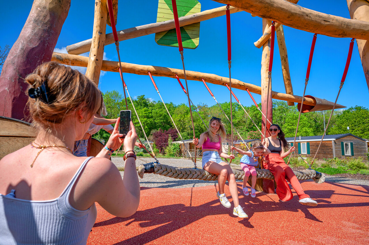 Family on large braided swing, playground, camping CAPFUN Suzel (68).