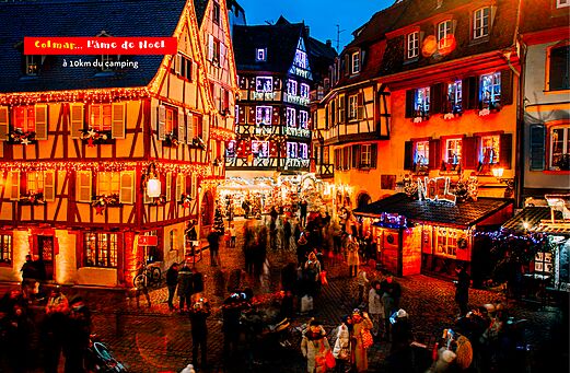 Magical Christmas market in Colmar, Alsace, with illuminated half-timbered houses.
