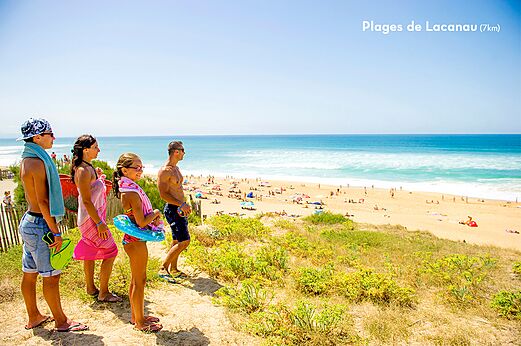 Lacanau beach with family looking at the ocean, Gironde, Nouvelle-Aquitaine.