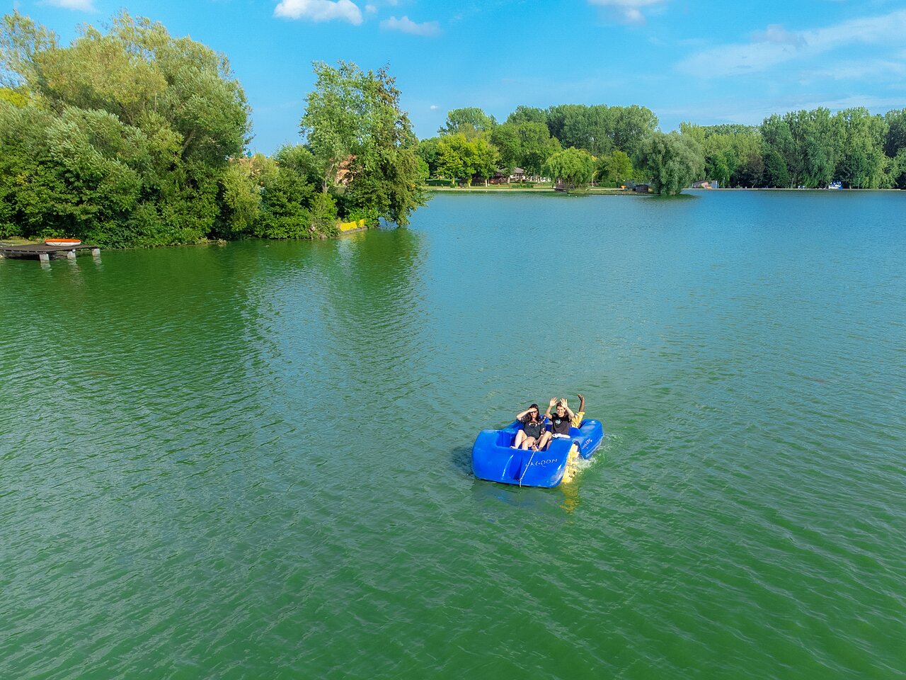 Blue pedal boat on lake with holidaymakers CAPFUN Tensch Jolie Grostenquin (57).