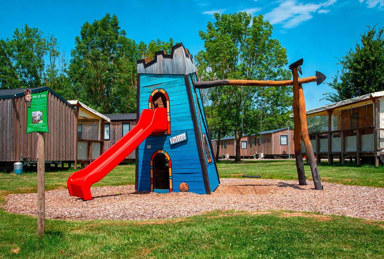 Playground, slide, swing, and Mobile homes at CAPFUN Tensch Jolie campsite (57).