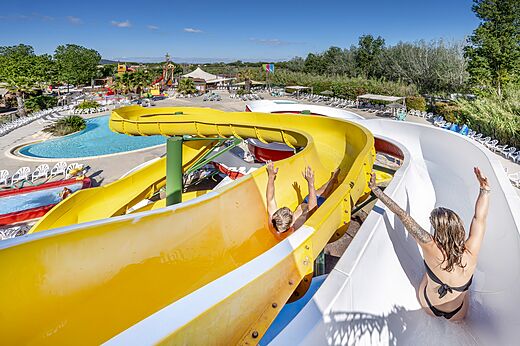 Giant water slides with swimmers at CAPFUN Teorix campsite in MARSEILLAN PLAGE (34).