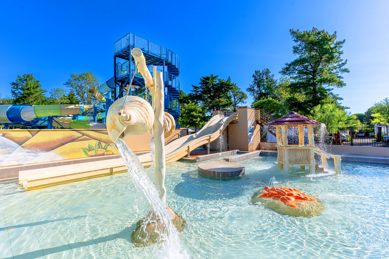 Swimming pool with slides and water games at CLICOCHIC Texas campsite in Argel�s sur Mer (66).