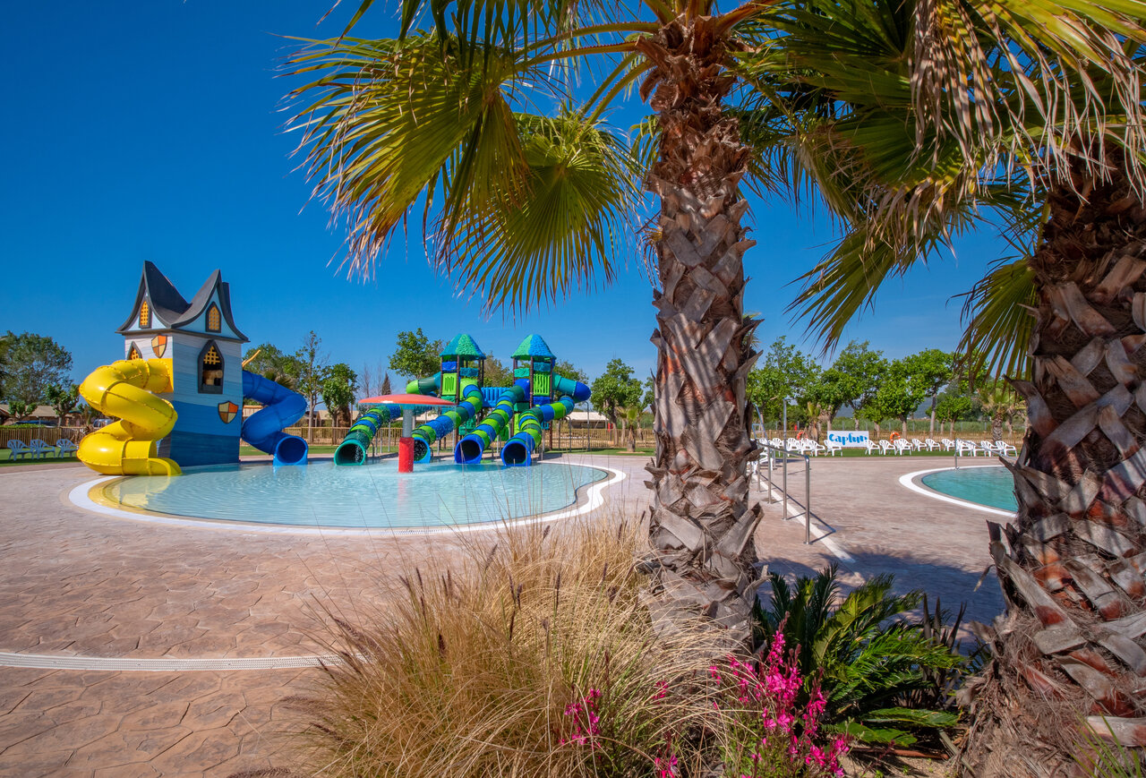 Water park with colorful slides and children's pool at CAPFUN Tordera-Nacions campsite in Malgrat de Mar (08).