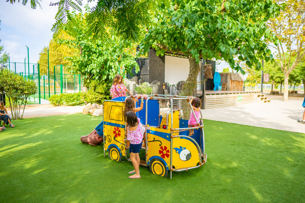 Children on bus playground at CAPFUN Tordera-Nacions campsite in Malgrat de Mar.