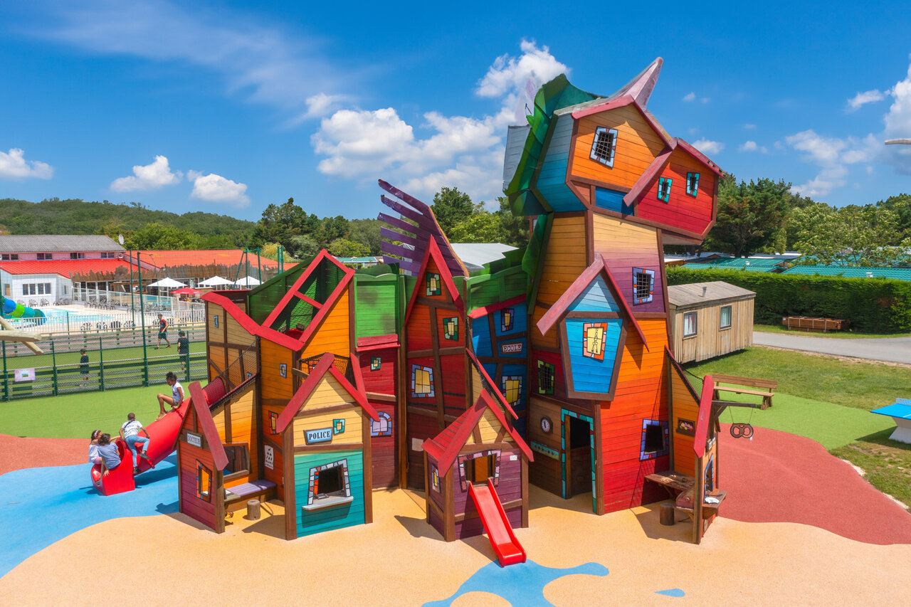 Colorful playground, slides, children, pool at CAPFUN Celeste in Breuillet (17).