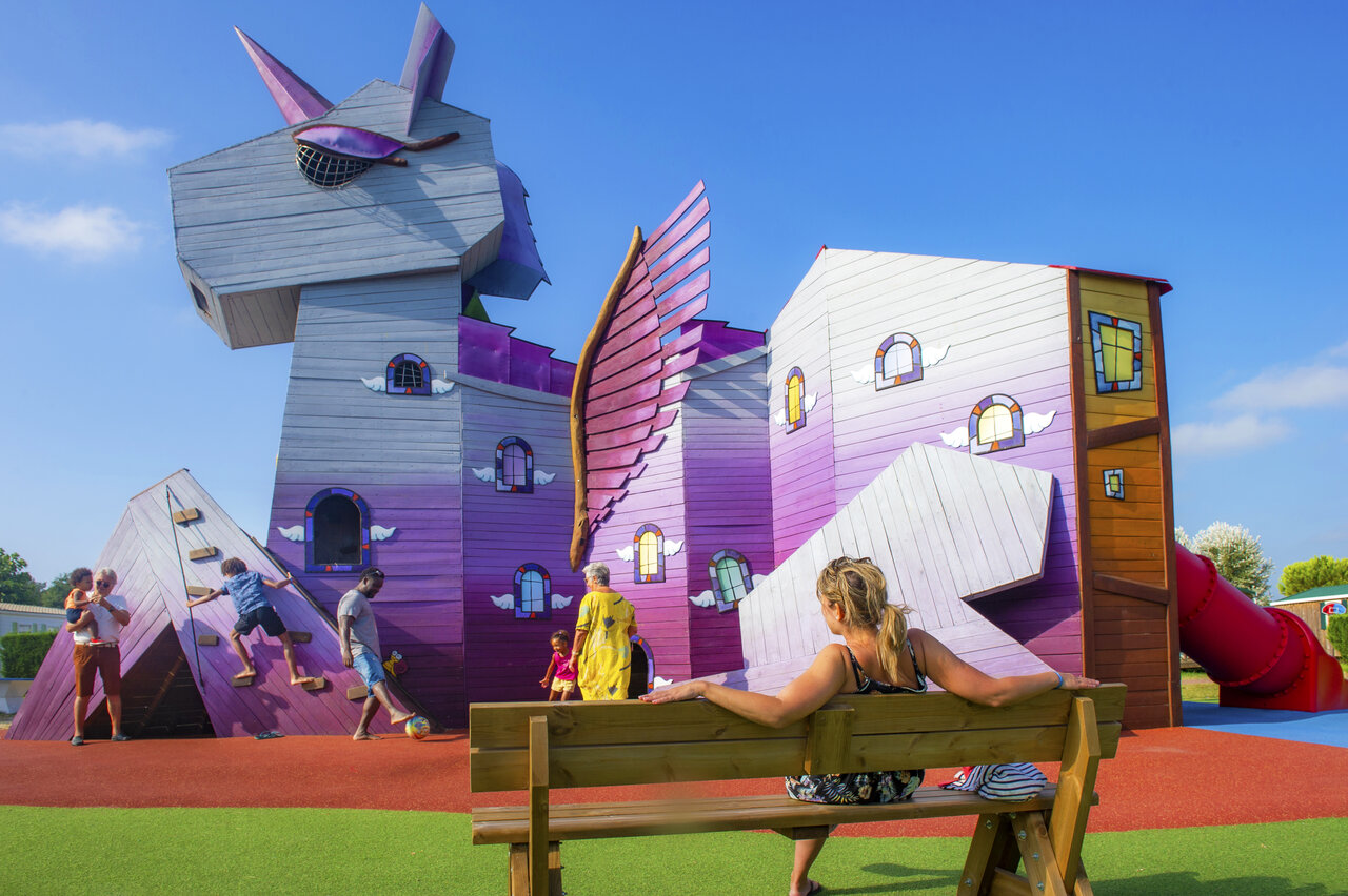 Purple dragon playground, slide, children, at CAPFUN Celeste campsite in Breuillet.